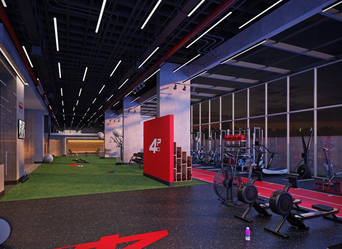 Interior da 4PERFORM: área de treino com gramado sintético e equipamentos